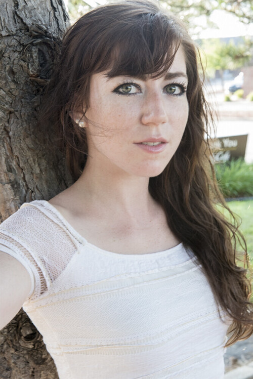 Headshot-by-tree.jpg